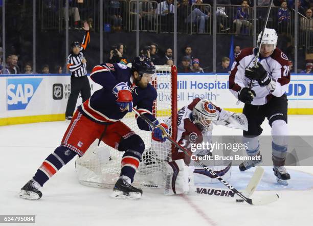 Rick Nash of the New York Rangers skates against Calvin Pickard and Patrick Wiercioch of the Colorado Avalanche during the second period at Madison...