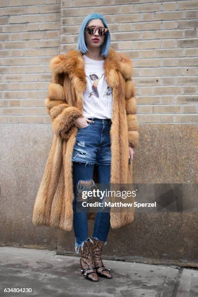 Alexa Escobar is seen attending Creatures of the Wind during New York Fashion Week wearing a fur coat with ripped jeans on February 11, 2017 in New...