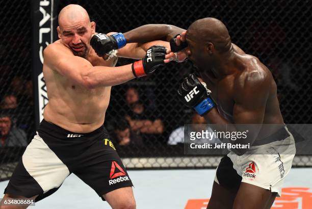 Jared Cannonier kicks Glover Teixeira of Brazil in their light heavyweight bout during the UFC 208 event inside Barclays Center on February 11, 2017...