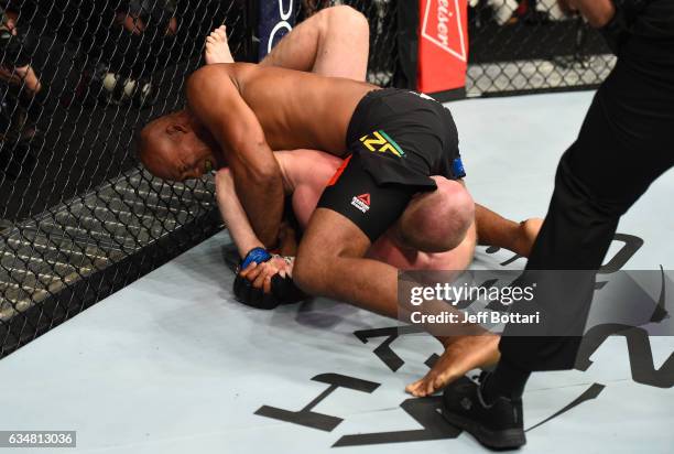 Ronaldo Souza of Brazil attempts to submit Tim Boetsch in their middleweight bout during the UFC 208 event inside Barclays Center on February 11,...