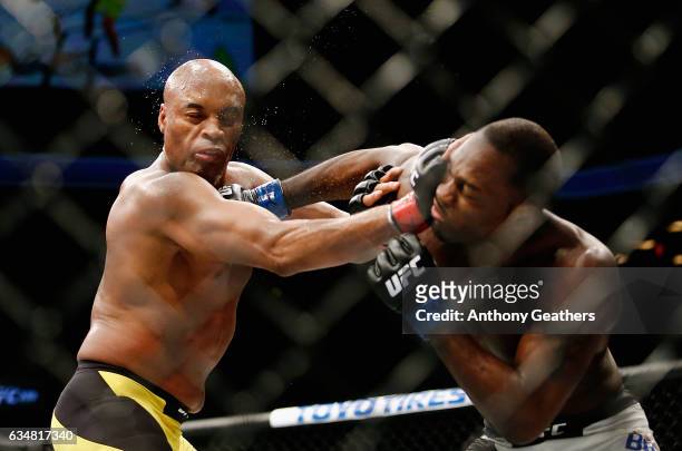 Derek Brunson of United States lands a punch against Anderson Silva of Brazil in their middleweight bout during UFC 208 at the Barclays Center on...