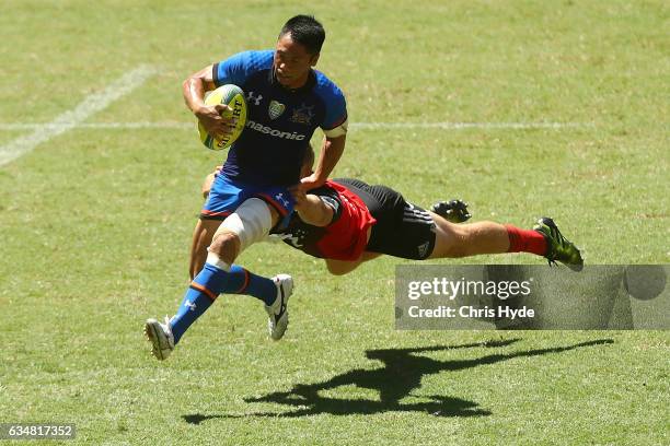 Takuya Yamasawa of the Panosonic Wild Knights is tackled during the Rugby Global Tens match between Wild Knights and Crusaders at Suncorp Stadium on...