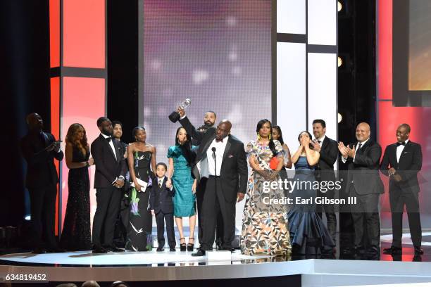 The cast of "Queen Sugar," winner of the Outstanding Drama Series Award, pose on stage at the 48th NAACP Image Awards at Pasadena Civic Auditorium on...