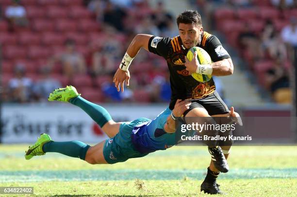 Luke Jacobson of the Chiefs breaks away from the defence during the Rugby Global Tens semi-final match between the Chiefs and Bulls at Suncorp...