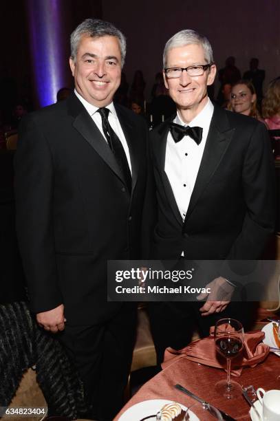 Apple Senior Vice President of Internet Software and Services Eddy Cue and Apple CEO Tim Cook attend Pre-GRAMMY Gala and Salute to Industry Icons...