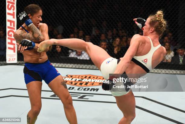 Holly Holm kicks Germaine de Randamie of The Netherlands in their women's featherweight championship bout during the UFC 208 event inside Barclays...