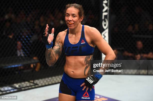 Germaine de Randamie of The Netherlands celebrates her victory over Holly Holm in their women's featherweight championship bout during the UFC 208...