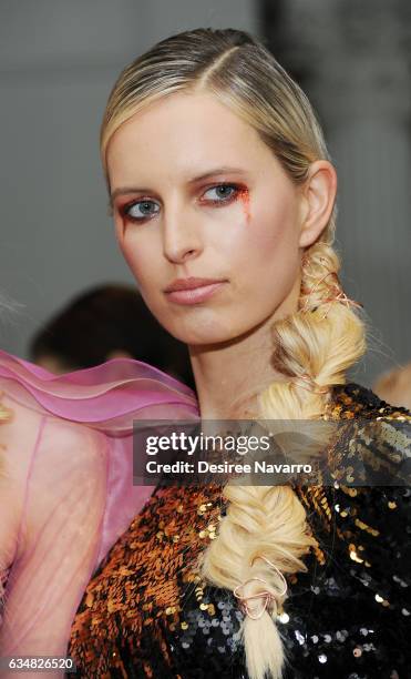 Model Karolina Kurkoval poses backstage at the Christian Siriano show during, New York Fashion Week: The Shows at The Plaza Hotel on February 11,...