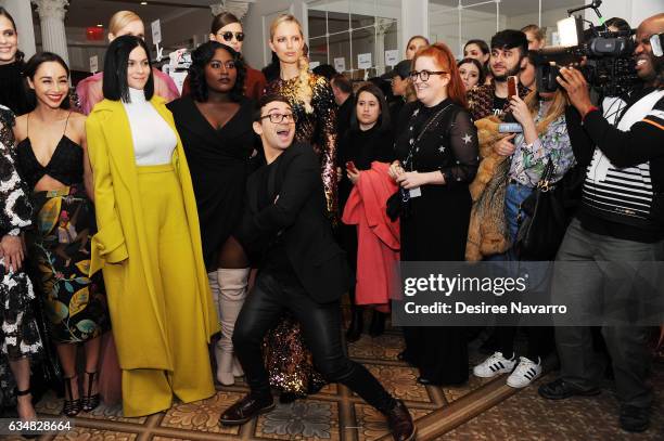 Cara Santana, Leigh Lezark, Danielle Brooks and Karolina Kurkova pose with designer Christian Siriano backstage at the Christian Siriano show during,...