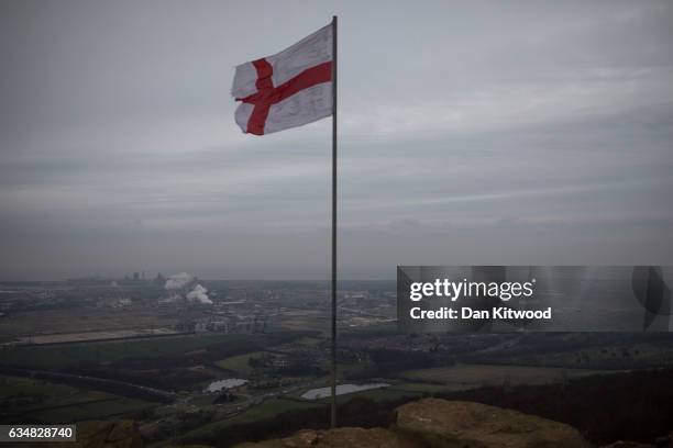 St Georges flag stands as a tribute to the murdered soldier Lee Rigby on top of Eston Nab in North Yorkshire, which looks down at the view over the...