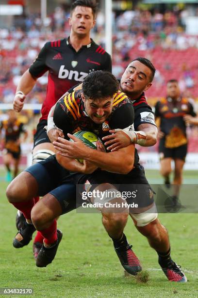 Luke Jacobson of the Chiefs make a break to score a try during the Rugby Global Tens Final match between Chiefs and Crusaders at Suncorp Stadium on...
