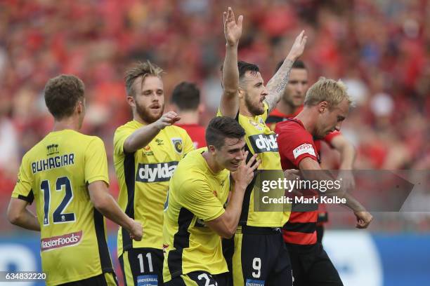 Roy O'Donovan of the Mariners celebrates with his team mates after scoring a goal during the round 19 A-League match between the Western Sydney...