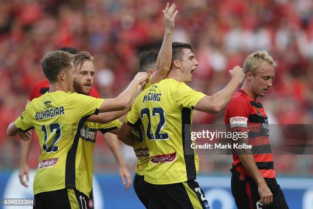 Jake McGing of the Mariners celebrates with Roy O'Donovan of the Mariners after he scored a goal during the round 19 A-League match between the...