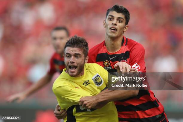 Liam Rose of the Mariners is fouled in front of goal by Jonathan Aspropotamitis of the Wanderers during the round 19 A-League match between the...