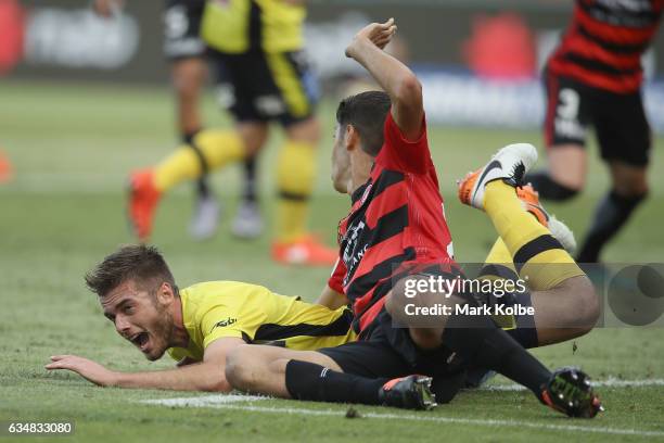 Liam Rose of the Mariners shouts as he is fouled in front of goal by Jonathan Aspropotamitis of the Wanderers during the round 19 A-League match...