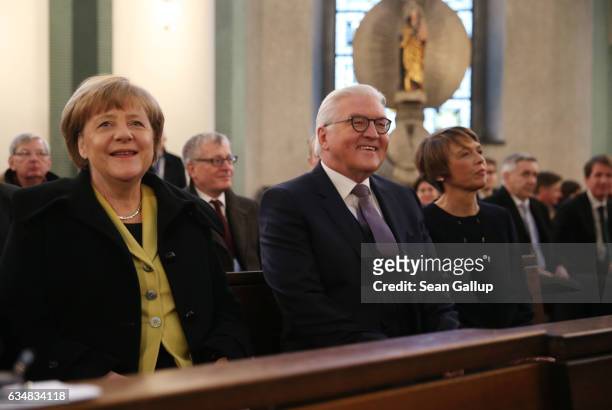 Frank-Walter Steinmeier , candidate for German president, his wife Elke Buedenbender and German Chancellor Angela Merkel attend a church service at...