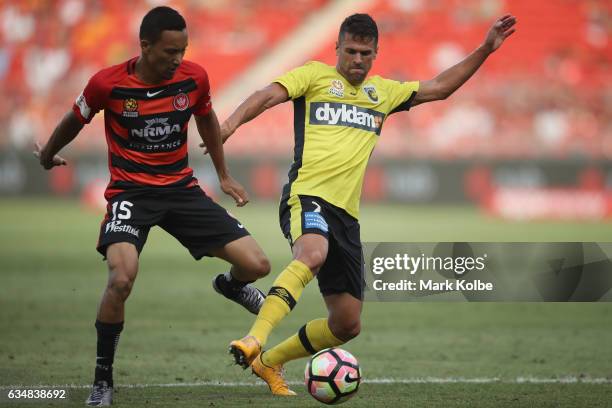 Kearyn Baccus of the Wanderers and Fabio Ferreira of the Mariners compete for the ball during the round 19 A-League match between the Western Sydney...