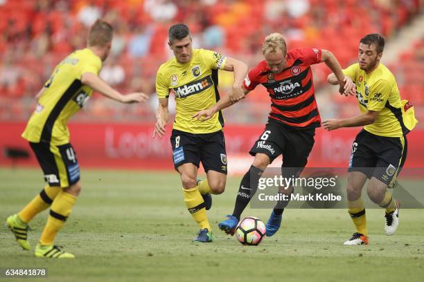 Mitch Nichols of the Wanderers takes on the Mariners defence during the round 19 A-League match between the Western Sydney Wanderers and the Central...