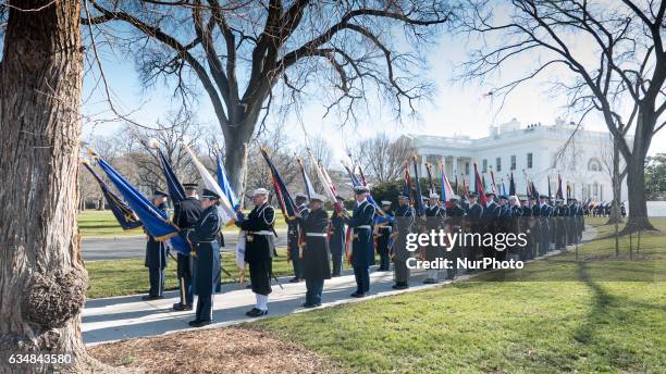 Members of the Honor Guard prepare for the arrival of Japanese Prime Minster Shinz Abe, on the South Lawn of the White House in Washington, DC on...