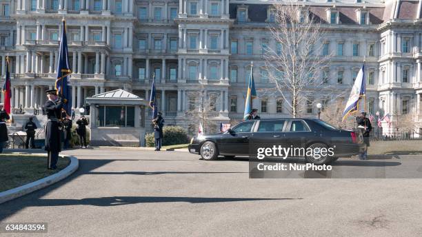 Members of the Honor Guard welcome Japanese Prime Minster Shinz Abe, in front of the West Wing of the White House, with the Eisenhower Executive...