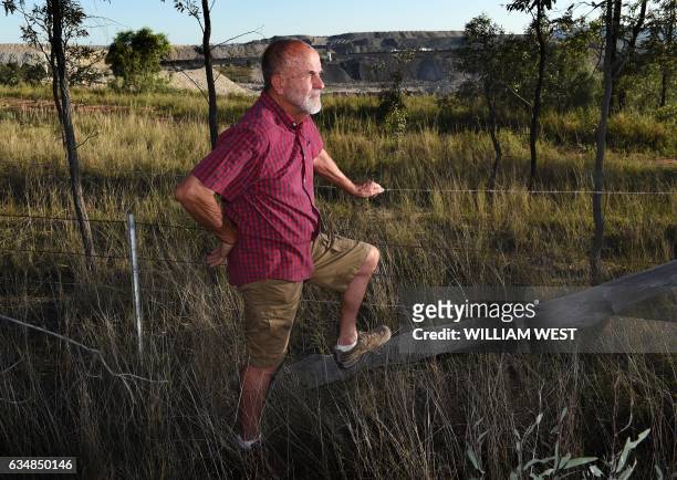 Environmental activist John Krey from the small Australian village of Bulga looks out over a coal mine in the Hunter Valley on November 18, 2015. AFP...