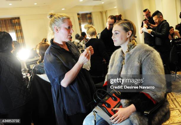 Model prepares backstage at the Christian Siriano show during, New York Fashion Week: The Shows at The Plaza Hotel on February 11, 2017 in New York...