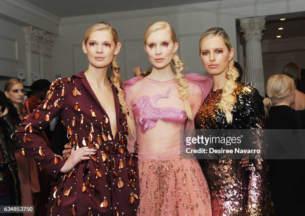 Model Karolina Kurkoval poses with models backstage at the Christian Siriano show during, New York Fashion Week: The Shows at The Plaza Hotel on...