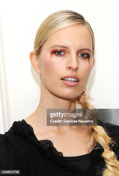 Model Karolina Kurkoval poses backstage at the Christian Siriano show during, New York Fashion Week: The Shows at The Plaza Hotel on February 11,...
