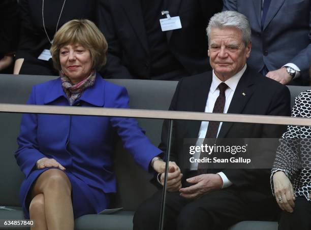 Outgoing German President Joachim Gauck holds the hand of First Lady Daniela Schadt during the election of the new president of Germany by the...