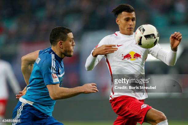 Davie Selke of RB Leipzig is challenged by Kyriakos Papadopoulos of Hamburger SV during the Bundesliga match between RB Leipzig and Hamburger SV at...