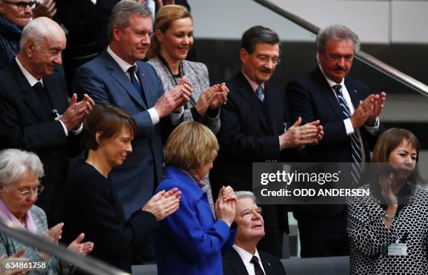 Outgoing German President Joachim Gauck is applauded by his Partner Daniela Schadt , German actor Armin Mueller-Stahl , former President Christian...