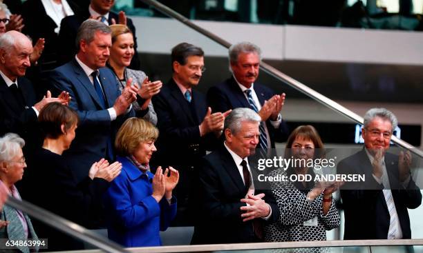 Outgoing German President Joachim Gauck is applauded by his Partner Daniela Schadt , German actor Armin Mueller-Stahl, former President Christian...