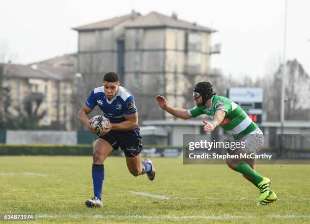 Treviso , Italy - 12 February 2017; Adam Byrne of Leinster goes over to score his side's fourth try despite the attention of Ian McKinley of Benetton...