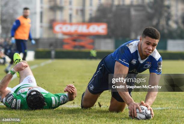 Treviso , Italy - 12 February 2017; Adam Byrne of Leinster goes over to score his side's fourth try despite the attention of Ian McKinley of Benetton...