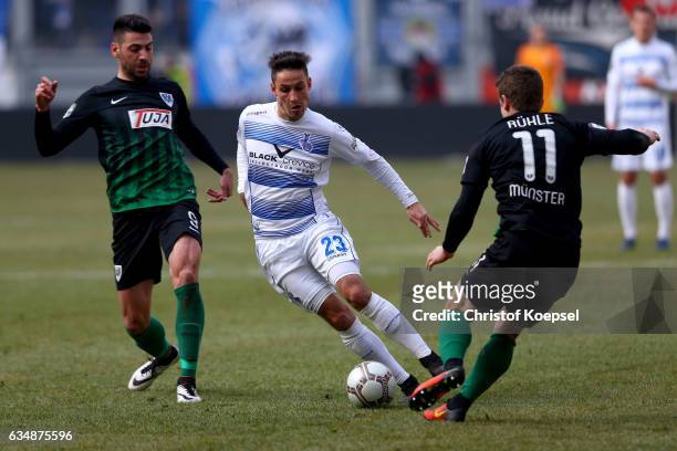 Mirkan Aydin of Muenster and Tobias Ruehle of Muenster challenge Fabian Schnellhardt of Duisburg during the Third League match between MSV Duisburg...