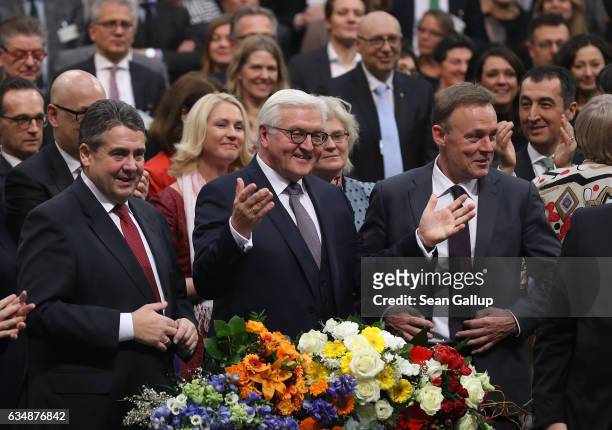 German President-elect Frank-Walter Steinmeier gestures as Foreign Minister Sigmar Gabriel and politician Thomas Oppermann look on following...