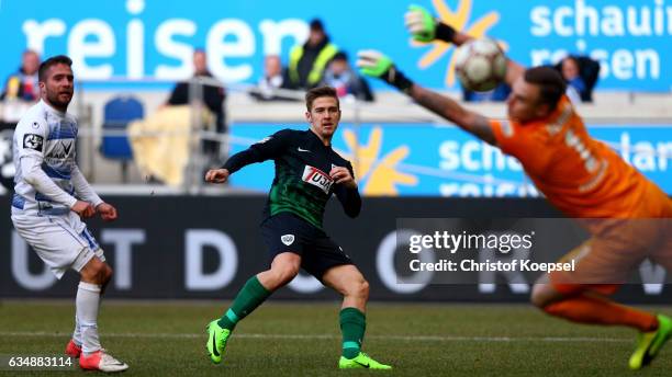 Martin Kobylanski of Muenster scores the second goal against Mark Flekken of Duisburg and Nico Klotz of Duisburg during the Third League match...