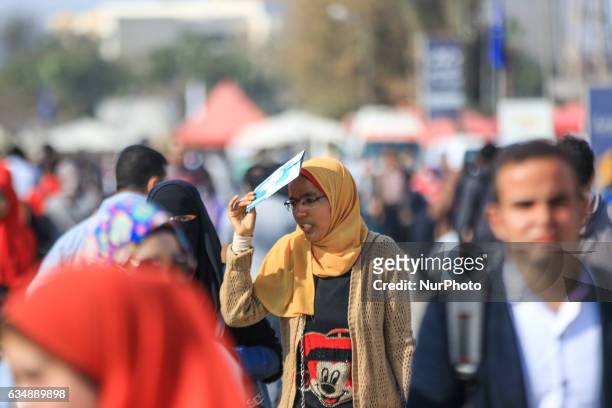Girl sheltering from the sun in Cairo, Egypt on 11 February 2017.