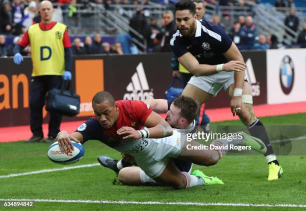 Gael Fickou of France dives over to score his team's opening try during the RBS Six Nations match between France and Scotland at Stade de France on...