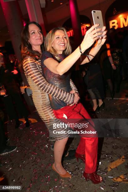 Ursula Karven and Natalia Woerner make a selfie during the BUNTE & BMW Festival Night 2017 during the 67th Berlinale International Film Festival...