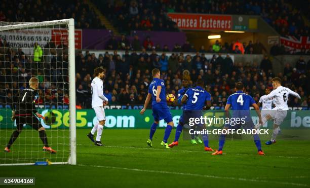 Swansea City's English defender Alfie Mawson shoots to score the opening goal of the English Premier League football match between Swansea City and...