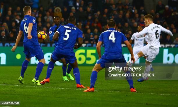 Swansea City's English defender Alfie Mawson shoots to score the opening goal of the English Premier League football match between Swansea City and...