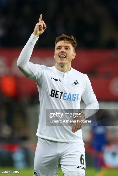 Alfie Mawson of Swansea City celebrates scoring his sides first goal of the match during the Premier League match between Swansea City and Leicester...