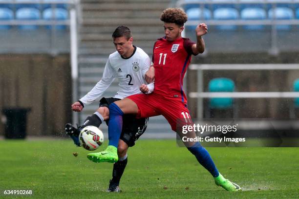 Jadon Malik Sancho of England U17 challenges Alexander Nitzl of Germany U17 during the U17 Algarve Cup Tournament Match between England U17 and...