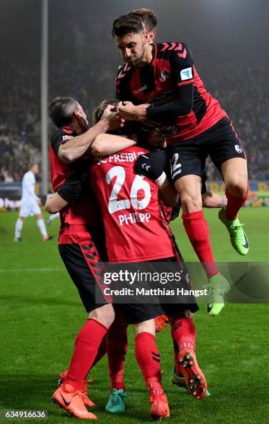 Maximilian Philipp of Freiburg celebrates with team mates after scoring his teams second goal during the Bundesliga match between SC Freiburg and 1....