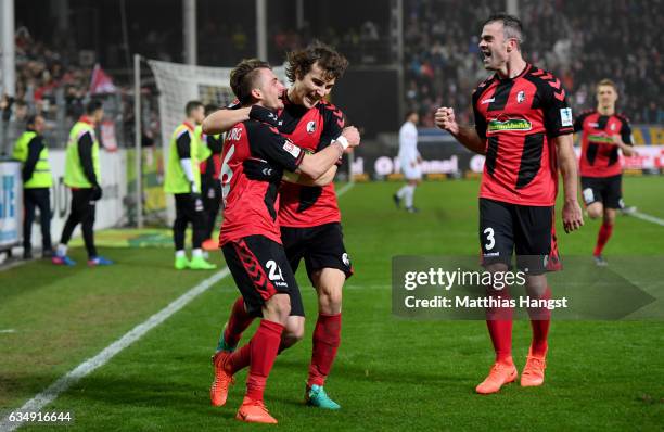 Maximilian Philipp of Freiburg celebrates with team mates after scoring his teams second goal during the Bundesliga match between SC Freiburg and 1....