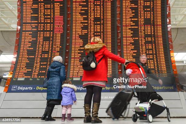 People are checking their flights on the Departures board at the Terminal 2 of Paris Charles de Gaulle Airport. On Sunday, 12 February in Paris,...