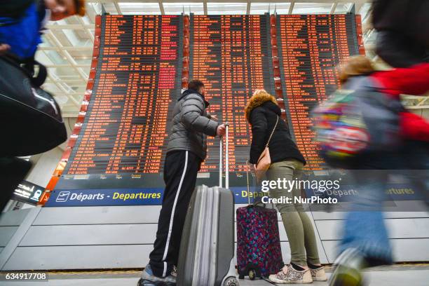 People are checking their flights on the Departures board at the Terminal 2 of Paris Charles de Gaulle Airport. On Sunday, 12 February in Paris,...