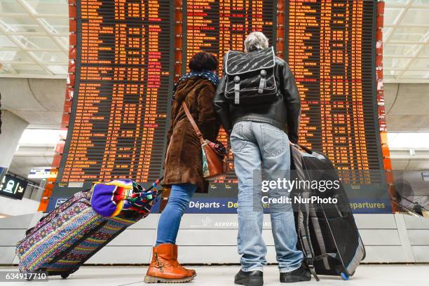 People are checking their flights on the Departures board at the Terminal 2 of Paris Charles de Gaulle Airport. On Sunday, 12 February in Paris,...