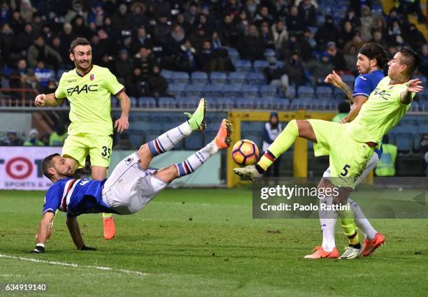 Fabio Quagliarella of Sampdoria and Erick Pulgar of Bologna during the Serie A match between UC Sampdoria andv Bologna FC at Stadio Luigi Ferraris on...